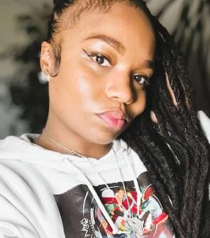 Jaelle Faison wearing ART by J.C.F. hoodie
